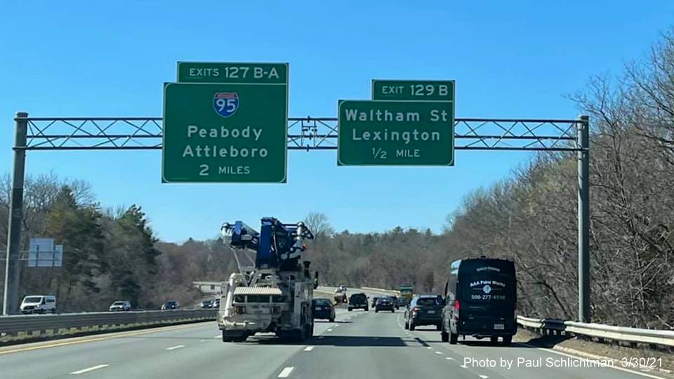 Image of advance overhead signs for I-95 and Waltham Street exits with new milepost based exit numbers on MA 2 West in Lexington, by Paul Schlichtman, March 2021
