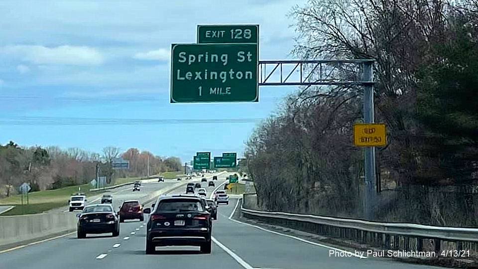 Image of 1 Mile advance sign for Spring Street exit with new milepost based exit number and yellow Old Exit 53 sign on support on MA 2 East in Lexington, by Paul Schlichtman, April 2021
