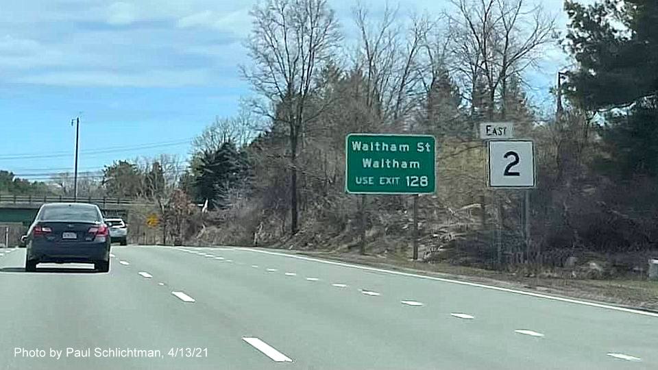 Image of auxiliary sign for Spring Street exit with new milepost based exit number on MA 2 East in Lexington, by Paul Schlichtman, April 2021