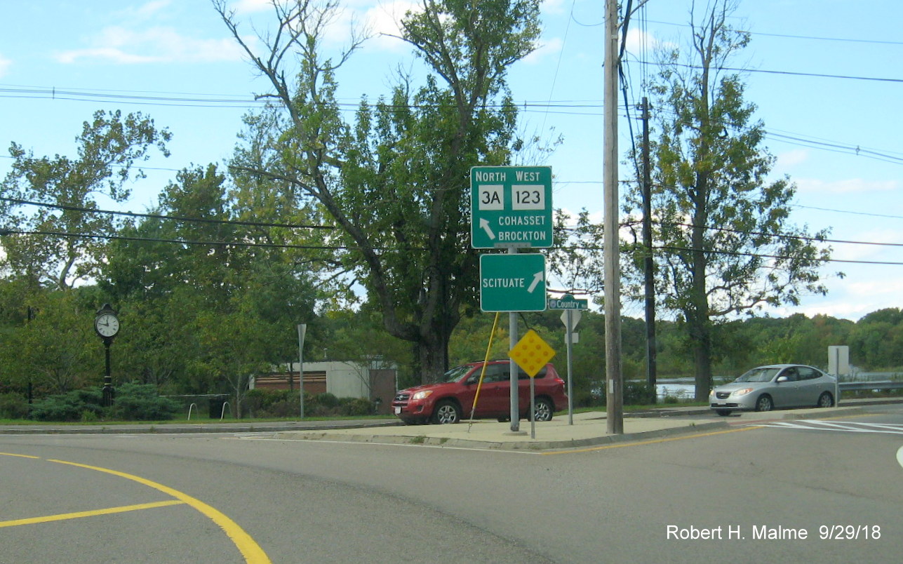 Image of guide signs at roundabout marking the intersection of MA 3A and MA 123 in Scituate