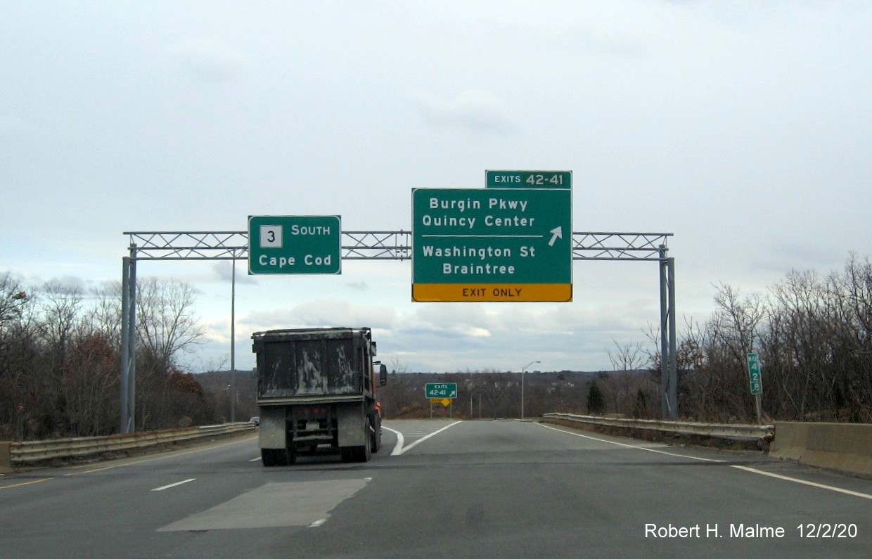 Image of overhead signs at ramp for Burgin Parkway/Washington Street exits with new milepost exit numbers on MA 3 South in Braintree, December 2020