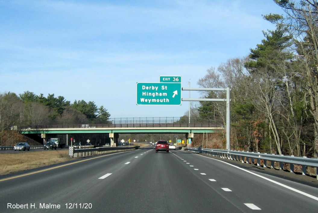 Image of overhead ramp sign for Derby Street exit with new milepost based exit number on MA 3 North in Hingham, December 2020