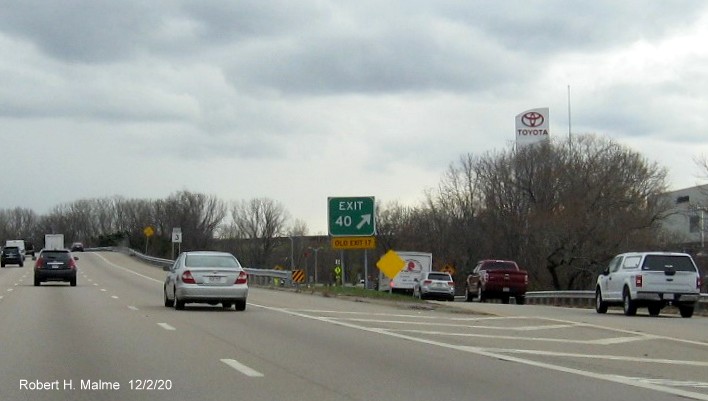 Image of gore sign for Union Street exit with new milepost exit number and yellow old exit number
                                     tab below on MA 3 South in Braintree, December 2020