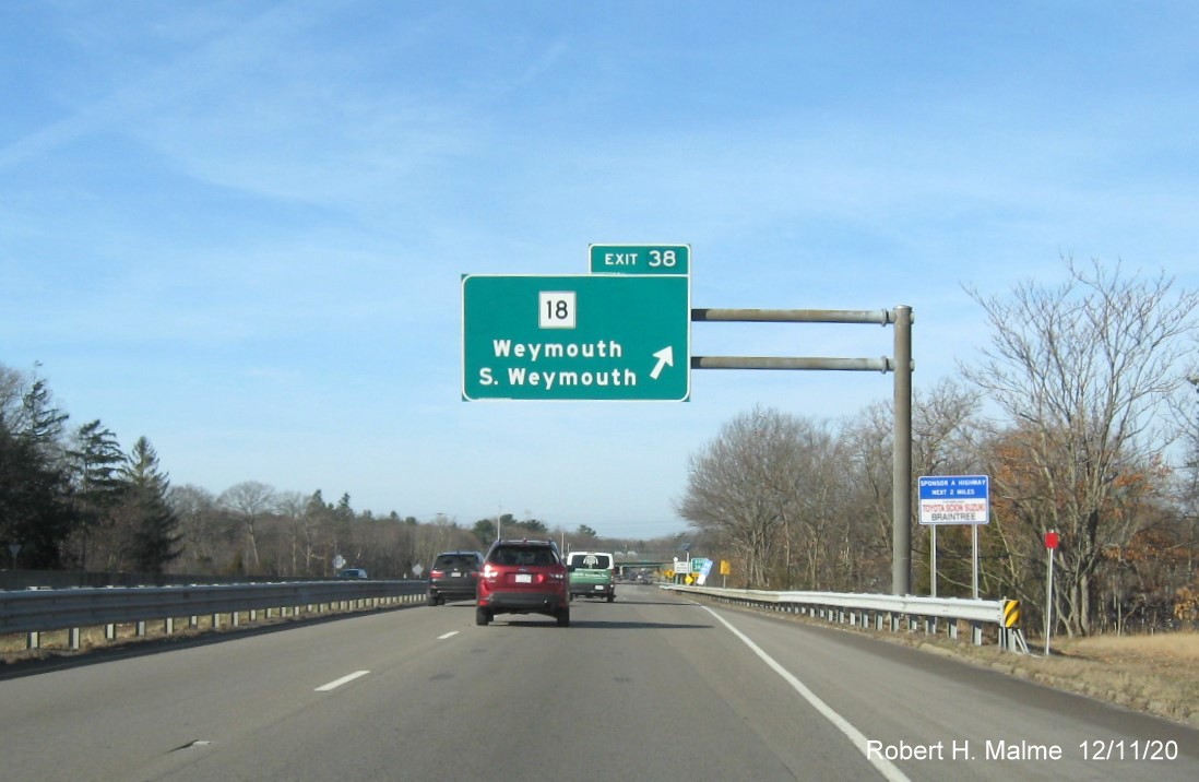 Image of overhead ramp sign for MA 18 exit with new milepost based exit number on MA 3 North in Weymouth, December 2020