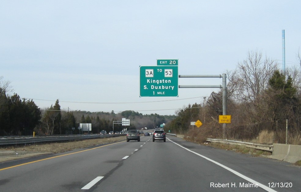 Image of 1-mile advance overhead sign for MA 3A exit with new milepost based exit number and yellow old exit number sign on support post on MA 3 North in Kingston, December 2020