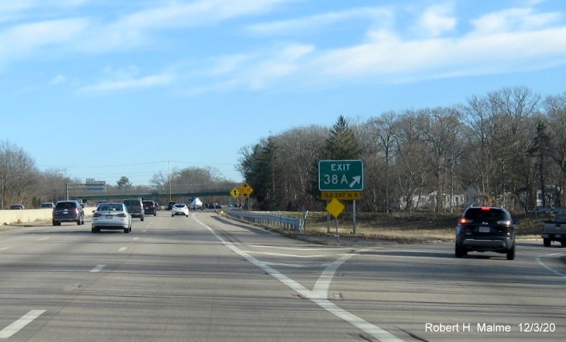 Image of gore sign for MA 18 North exit with new milepost based exit number and yellow old exit number tab below on MA 3 South in Weymouth, December 2020