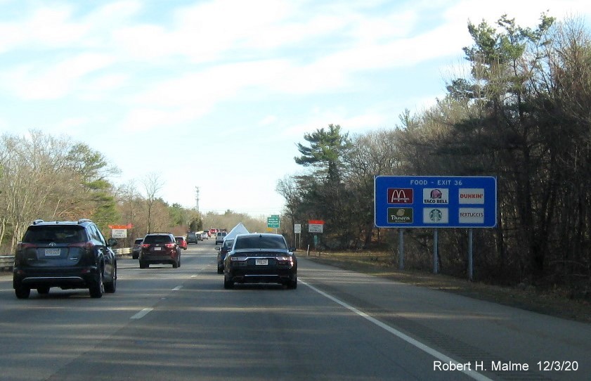 Image of blue Food services auxiliary sign for Derby Street exit with new milepost based exit number on MA 3 South in Weymouth, December 2020