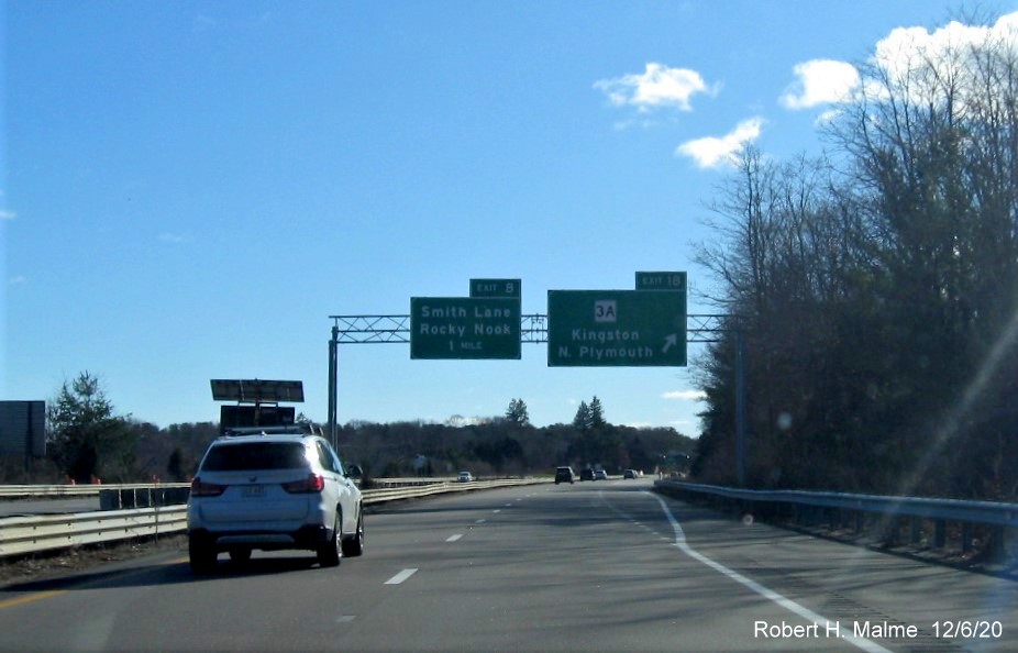 Image of the overhead signs at MA 3A exit with new milepost based exit number for 3A but existing exit number on left sign on MA 3 South in Duxbury, December 2020