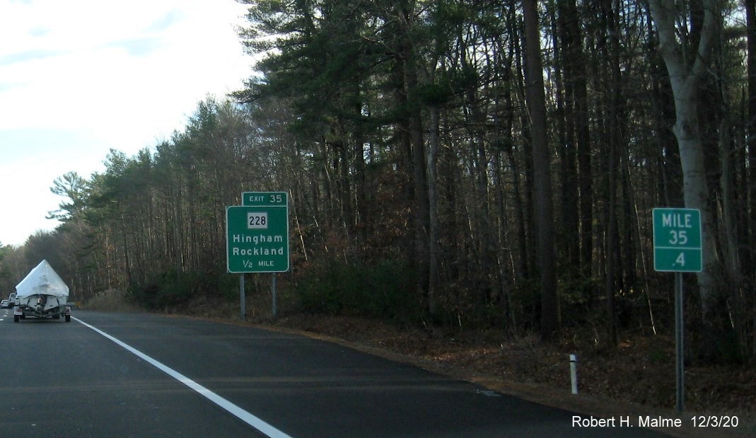 Image of 1/2 mile advance sign for MA 228 exit with new milepost based exit number on MA 3 South in Hingham, December 2020