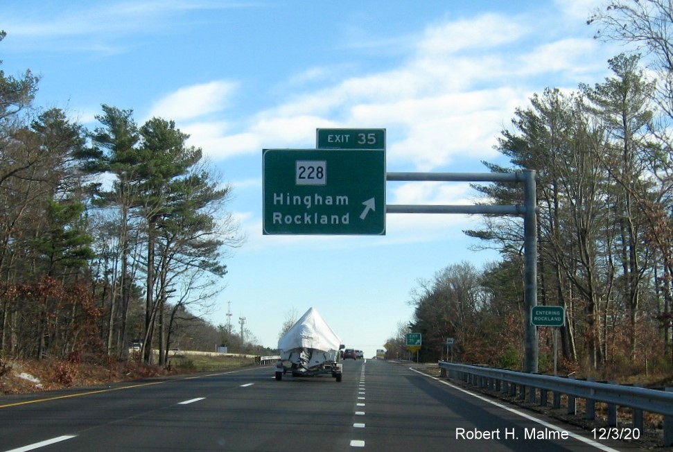 Image of overhead ramp sign for MA 228 exit with new milepost based exit number on MA 3 South in Rockland, December 2020