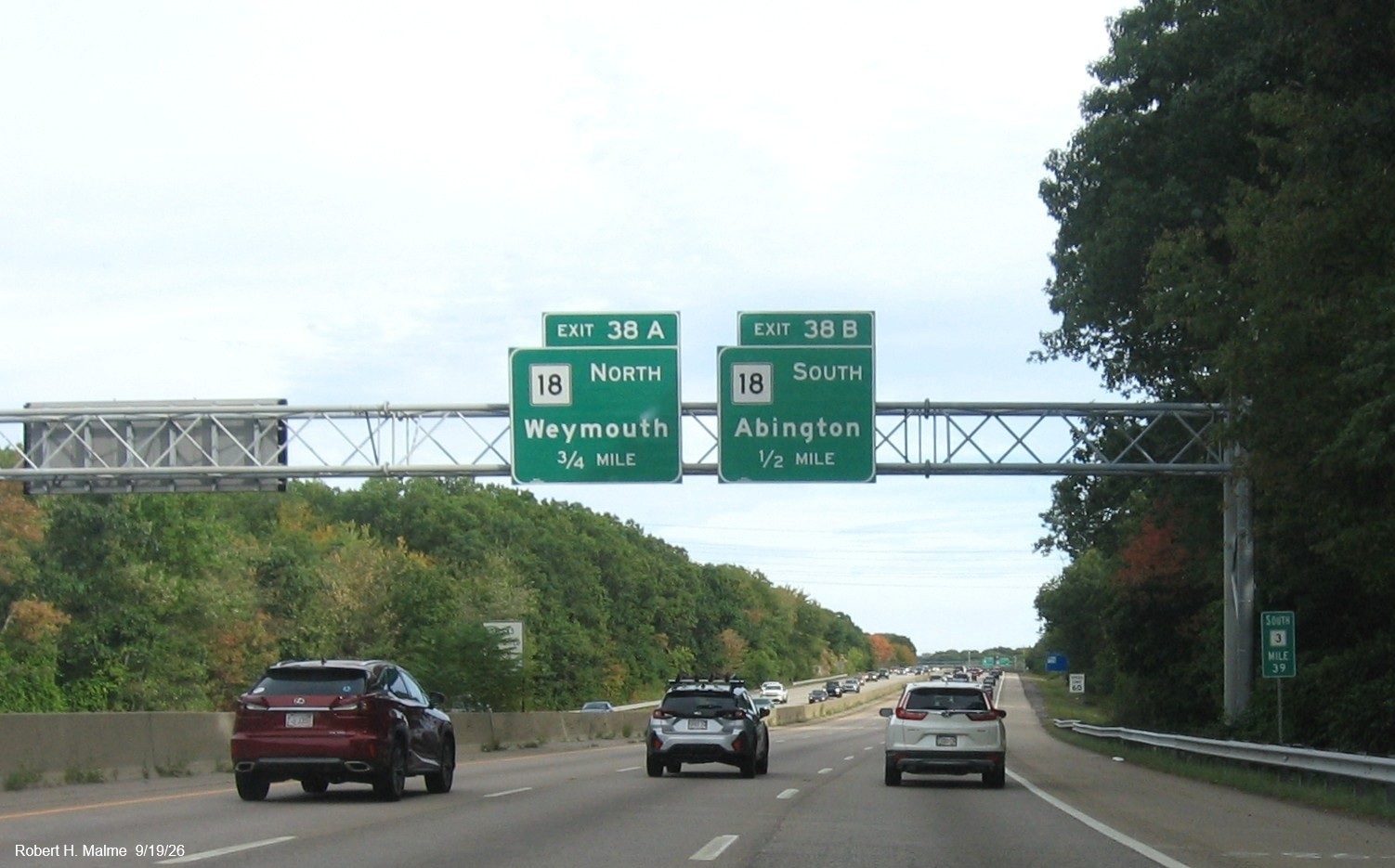 Image of new 1 mile advance overhead sign for the MA 18 exit on MA 3 South in Weymouth, 
	September 2026