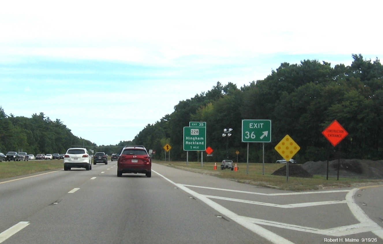Image of new gore sign for the Derby Street exit with new 1 Mile advance sign for the MA 228 
	exit beyond	on MA 3 South in Hingham, September 2026