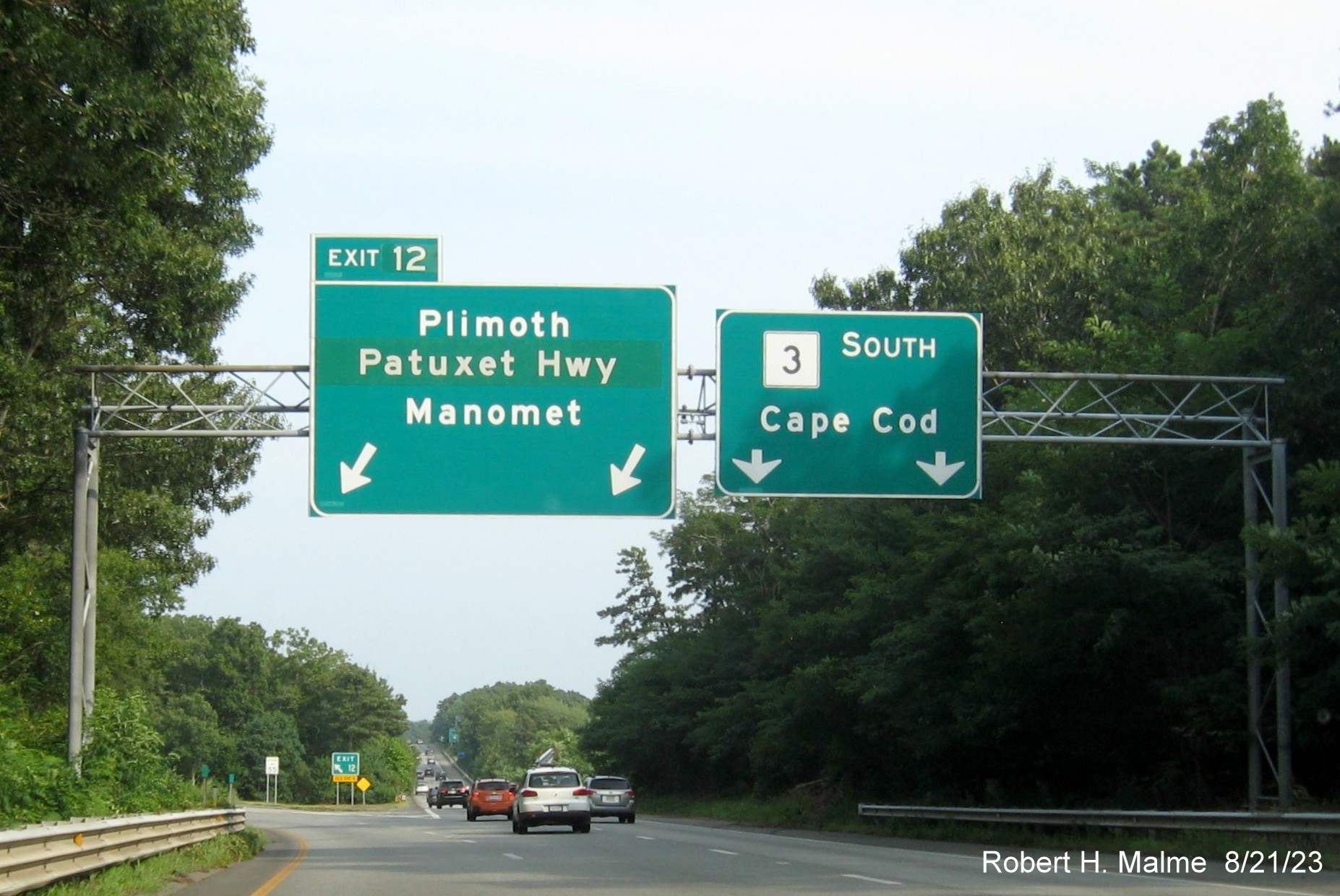 Image of overhead signage at exit ramp for Plimoth Patuxet (formerly Plimoth Plantation) Highway with yellow Left Exit panel removed from Exit 12 tab on MA 3 South in Plymouth, August 2023