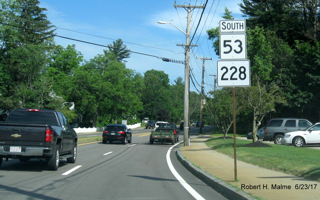 Image of new reassurance marker placed on existing post with erroneous MA 228 shield on MA 53 South in Hingham