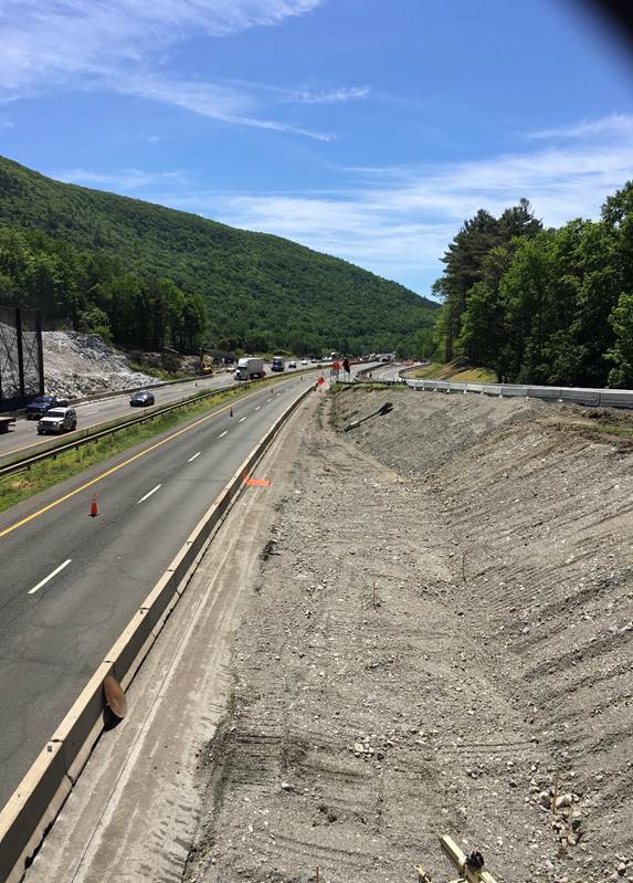 Image of landscaping being done at site of former Mass Pike Western Toll Plaza at Exit 1 in Stockbridge, by MassDOT