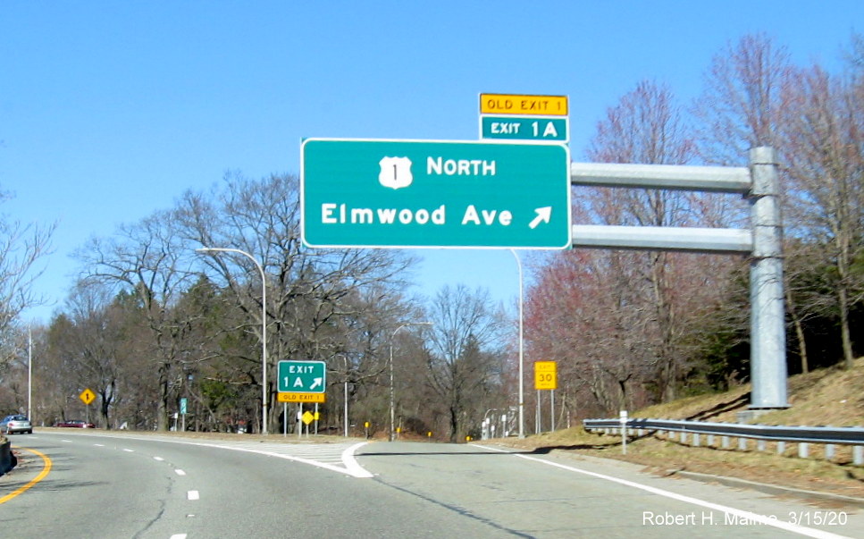Image of overhead ramp sign for US 1 North exit on RI 10 North in Providence showing new exit number and old exit number tab, taken March 2020