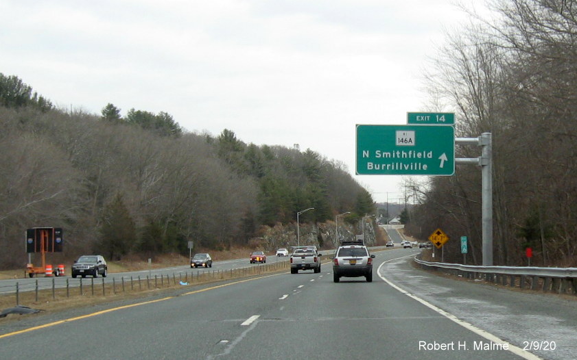 Image of recently placed overhead ramp sign with new milepost based exit number for RI 146A exit on RI 146 South in North Smithfield