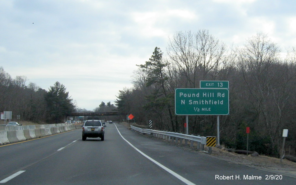 Image of ground mounted 1/2 mile advance sign with new milepost based exit number for Pound Hill Road exit on RI 146 South in North Smithfield
