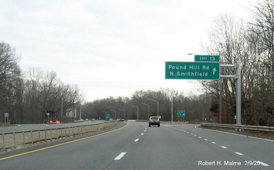 Image of recently placed overhead ramp sign with new milepost based exit number for Pound Hill Road exit on RI 146 South in North Smithfield