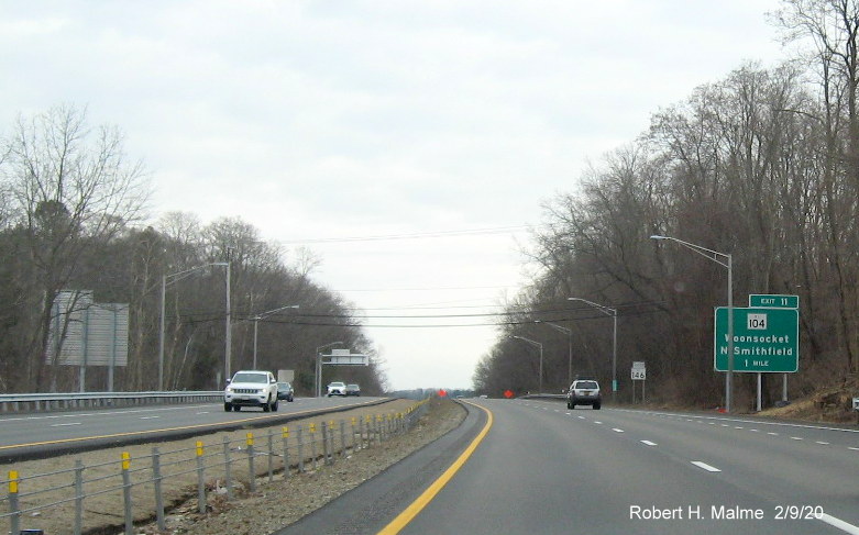 Image of 1-mile advance sign with new milepost based exit number for RI 104 exit on RI 146 South in North Smithfield