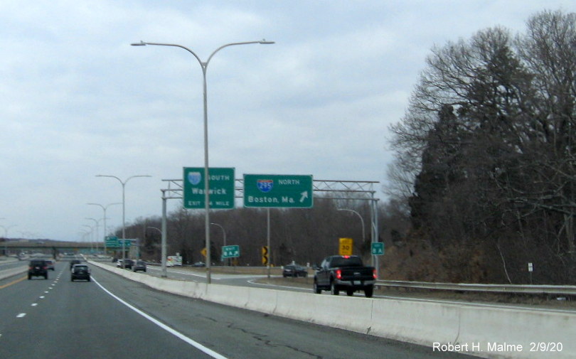 Image of new milepost based exit number sign on support posts for overhead signs at ramp to I-295 North from RI 146 North in Lincoln