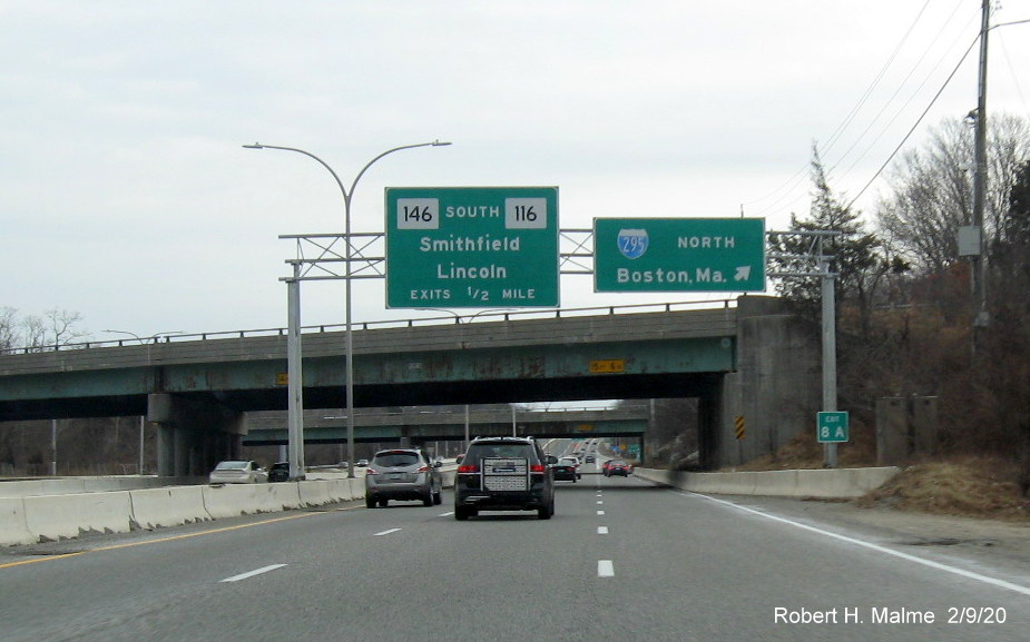 Image of new milepost based exit number sign on support posts for overhead ramp sign for I-295 North on RI 146 South in Lincoln