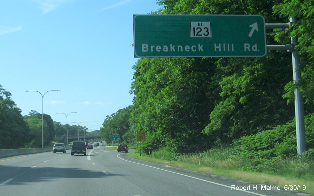 Image of overhead sign and new exit number gore sign for RI 123 exit on RI 146 South in Lincoln