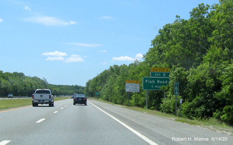 Image of newly placed 1-Mile Advance ground mounted sign with new exit number and yellow old exit number tab for Fish Road on RI 24 South in Tiverton, taken June 2020