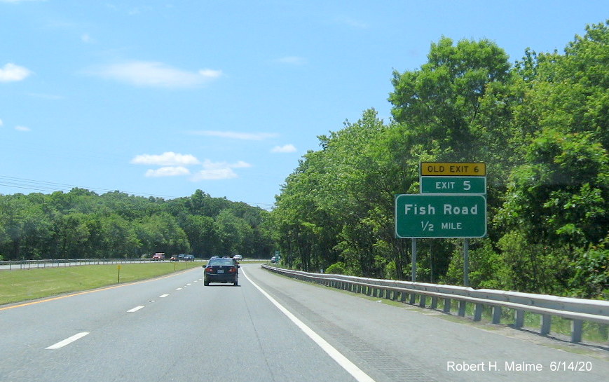 Image of newly placed 1/2 mile advance ground mounted sign for Fish Road with new exit number and yellow old exit number tab, on RI 24 South in Tiverton, taken June 2020