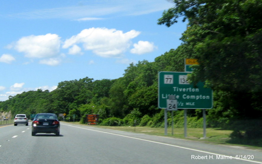 Image of newly placed 1/2 mile advance ground mounted sign for RI 77/RI 138 exit on RI 24 South in Tiverton, taken June 2020