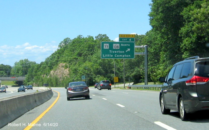 Image of newly placed overhead ramp sign for RI 77/RI 138 North exit with new exit number and yellow old exit tab on RI 24 South in Tiverton, taken June 2020
