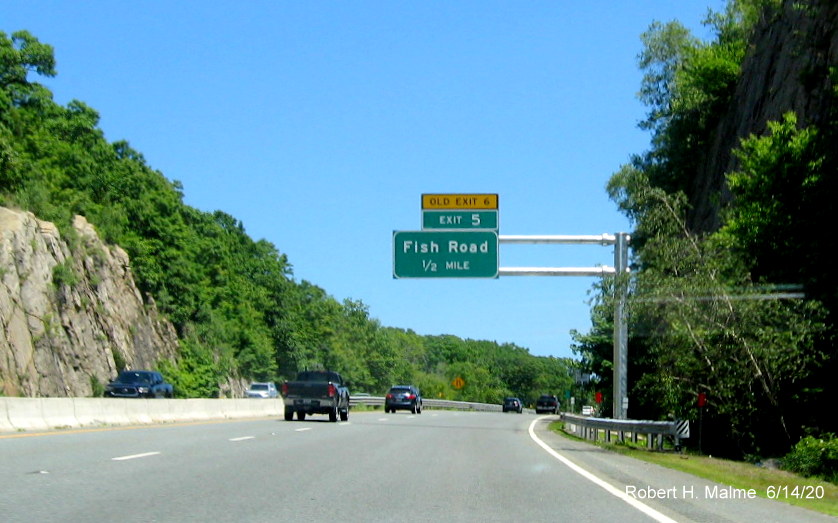 Image of newly placed 1/2 mile advance overhead sign with new exit number and yellow old exit number tab for Fish Road exit on RI 24 North in Tiverton, taken June 2020