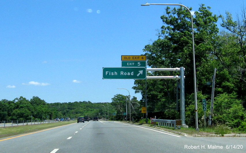 Image of newly placed overhead ramp sign for Fish Road exit with new exit number and yellow old exit number tab on RI 24 North in Tiverton, taken June 2020
