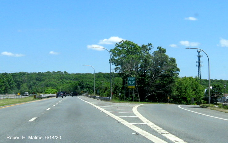 Image of new exit gore sign with new exit number and yellow old exit number tab for Fish Road exit on RI 24 North in Tiverton, taken June 2020