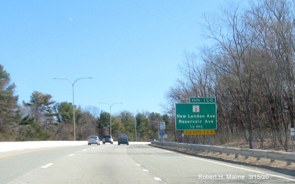 Ground mounted 1/2 mile advance sign for RI 2 exits on RI 37 East in Cranston with new exit numbers and old exit number tab posted at bottom of sign, taken in March 2020