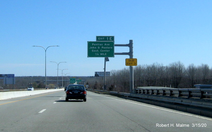 Image of overhead 1/4 mile advance sign for Pontiac Avenue exit on RI 37 East in Cranston with new exit number and old exit number tab posted on sign support, taken in March 2020
