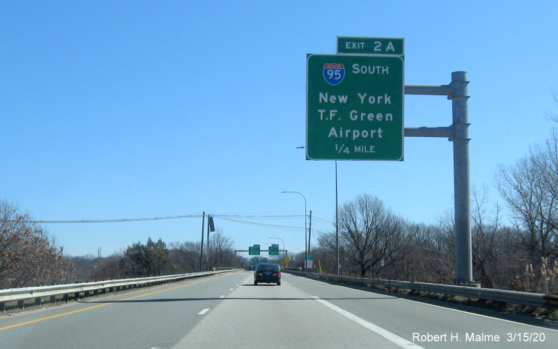 Image of overhead 1/4 mile advance sign for I-95 South exit on RI 37 East in Cranston with new exit number, but no old exit number tab, taken in March 2020