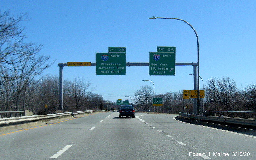 Overhead signage at ramp to I-95 South on RI 37 East in Cranston featuring new exit number and 1 old exit number tab, taken in March 2020