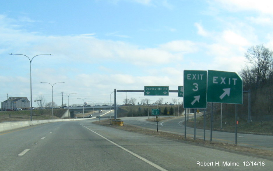 Image of newly placed Exit 3 gore sign hidden behind old exit sign for US 1 exit on RI 403 East in East Greenwich