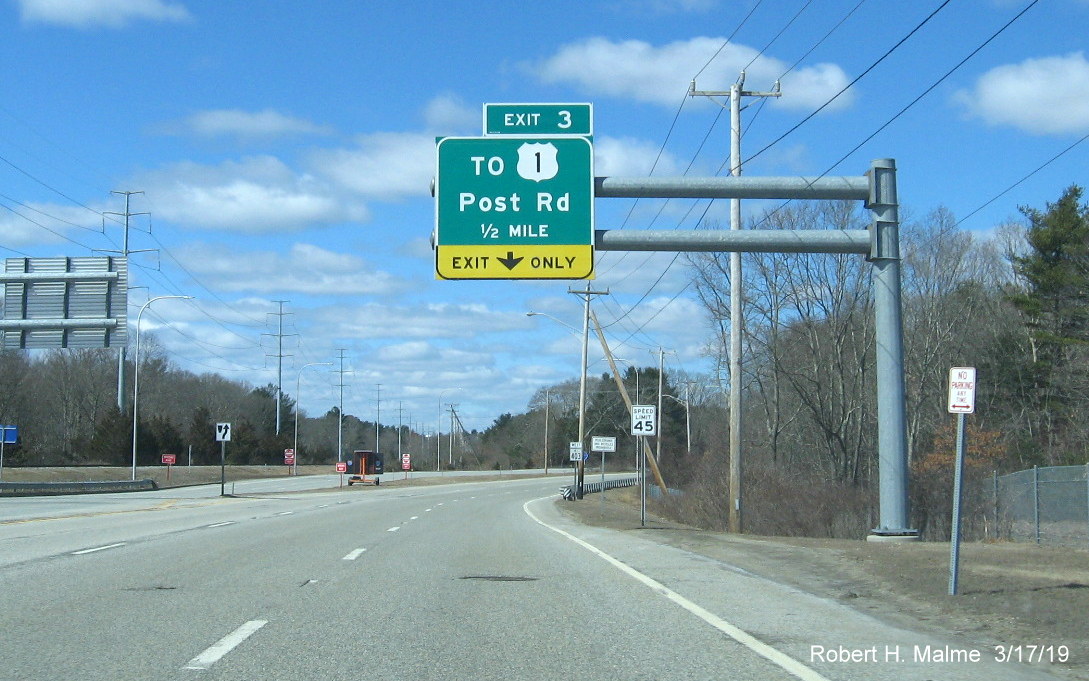 Image of overhead 1/2 mile advance sign with new exit number tab for To US 1 exit on RI 403 West in Davisville