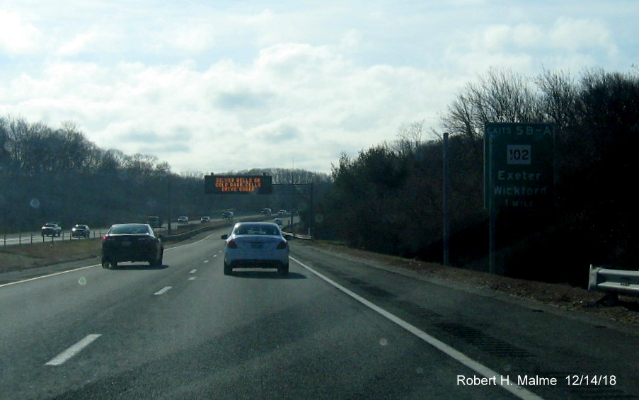 Image of new sign posts for RI 102 exit with new exit number on RI 4 South in East Greenwich