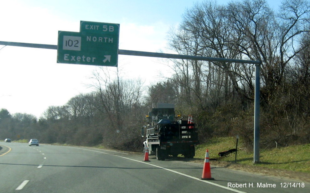 Image of sign contractor truck about to put up new sign posts ahead ofn RI 102 North exit on RI 4 South in East Greenwich