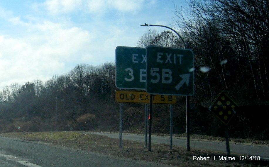 Image of new Exit 3B gore sign sitting behind current Exit 5B sign awaiting removal on RI 4 South at RI 102 exit