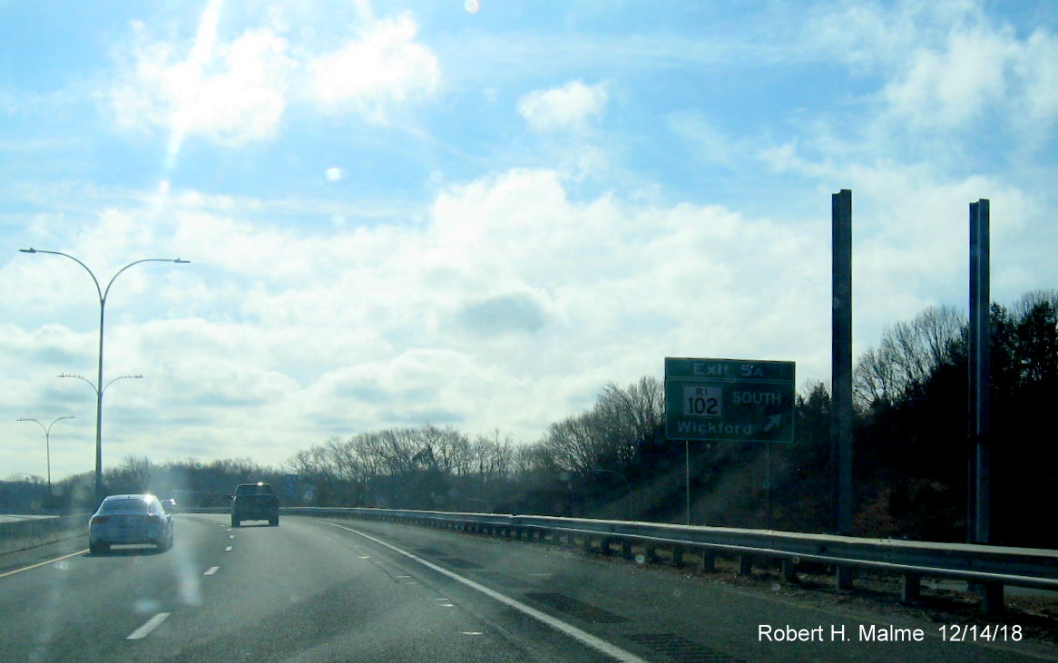 Image of new sign posts for RI 102 South exit ramp sign with new Exit 3B number on RI 4 South in East Greenwich