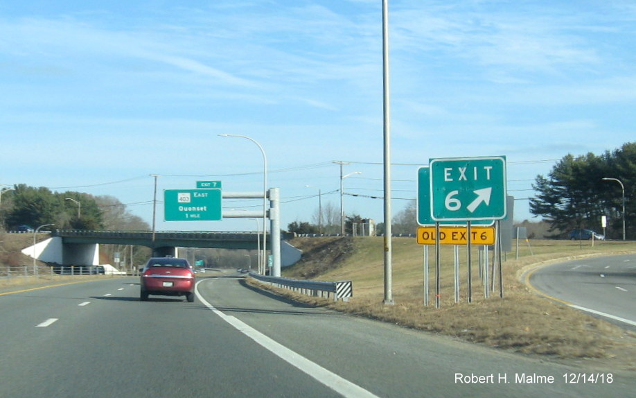 Image of new exit gore sign with old exit tab for RI 2 exit behind to be removed Exit 6 sign on RI 4 North in East Greenwich