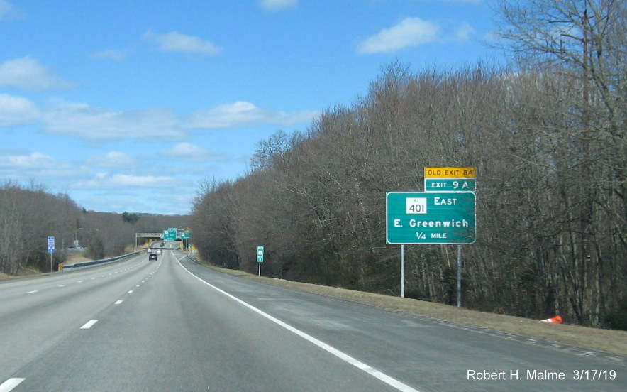 Image of new 1/2 mile advance sign for RI 401 East exit with new exit number and old exit number tab on RI 4 North in East Greenwich