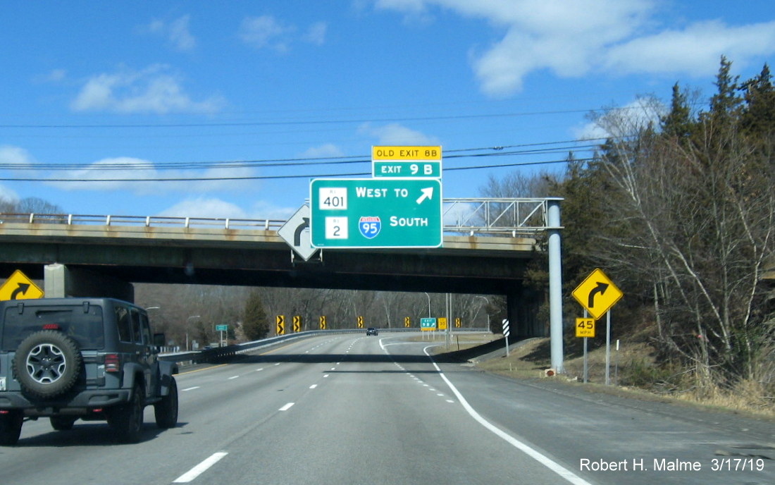 Image of new overhead ramp sign with new exit number and old exit number tab for RI 401 West to RI 2 I-95 North exit on RI 4 North in East Greenwich