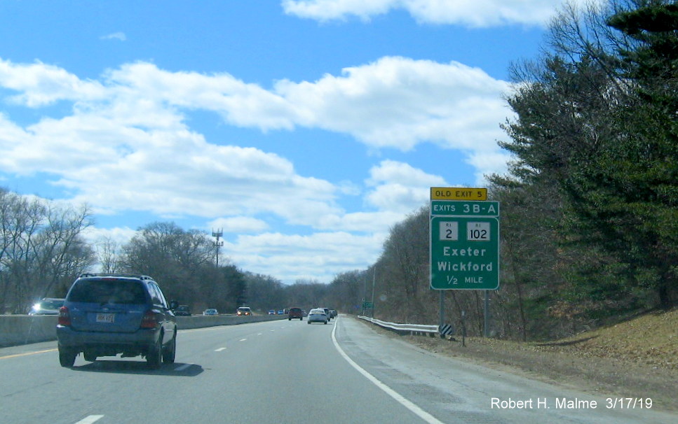 Image of new 1/2 mile sign with new exit number and old exit number tab for RI 2/RI 102 exits on RI 4 South in Exeter