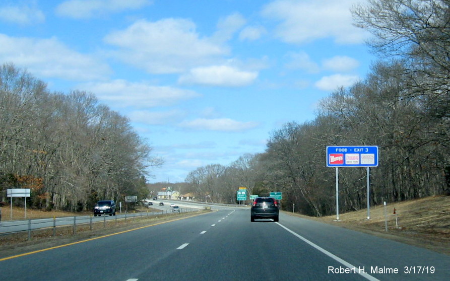 Image of new high-mounted blue services sign for RI 2/RI 102 exit on RI 4 North in Exeter