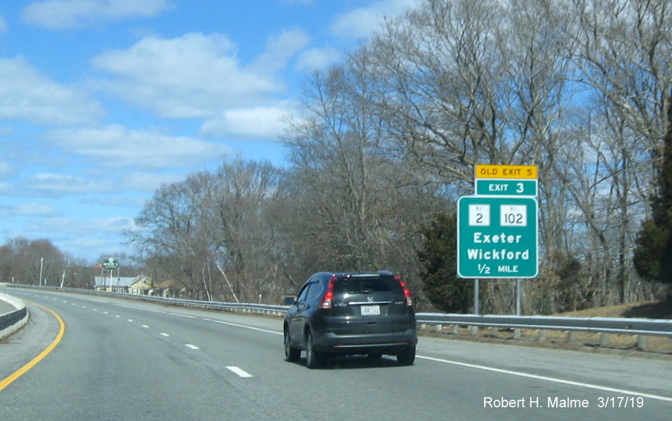 Image of new 1/2 mile advance sign with new exit number and old exit number tab for RI 2/RI 102 exit on RI 4 North in Exeter